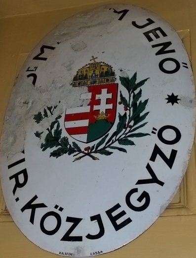Office sign: Dr. Maxim Jenő, kir. közjegyző (royal notary)